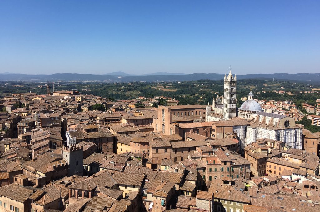View from the Torre del Mangia with the beautiful Duomo and Cattedrale (dome and cathedral) in white.